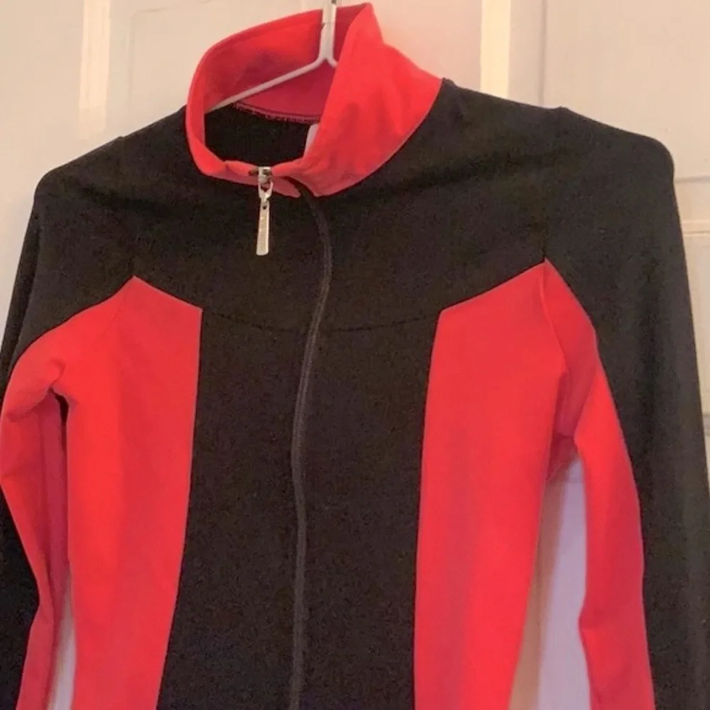 Mondor girls black and coral skating jacket in size 12 - 14